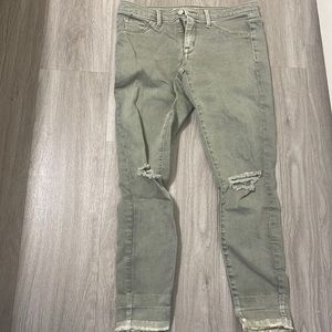 Washed out green skinny jeans